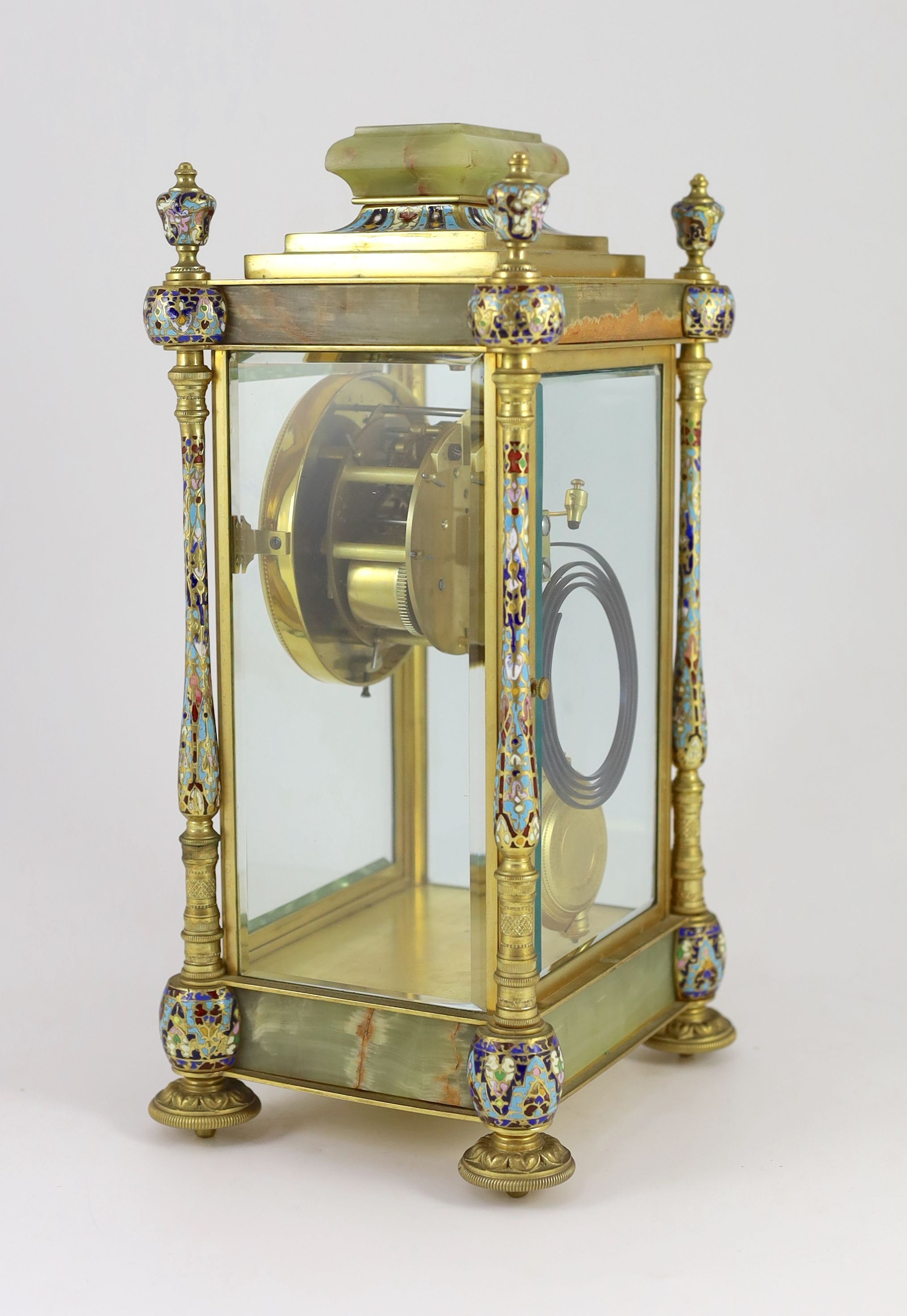 An early 20th century French ormolu and champleve enamel four glass mantel clock, width 18cm, depth 15cm, height 34cm